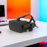 Oculus Rift virtual reality headsets on a gaming desk setup with RGB PC and immersive environment